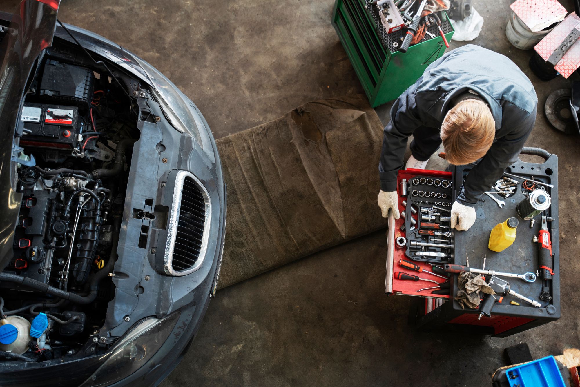 Mechanic using diagnostic scanner to identify engine fault codes at Bueno Garage in Everton Hills